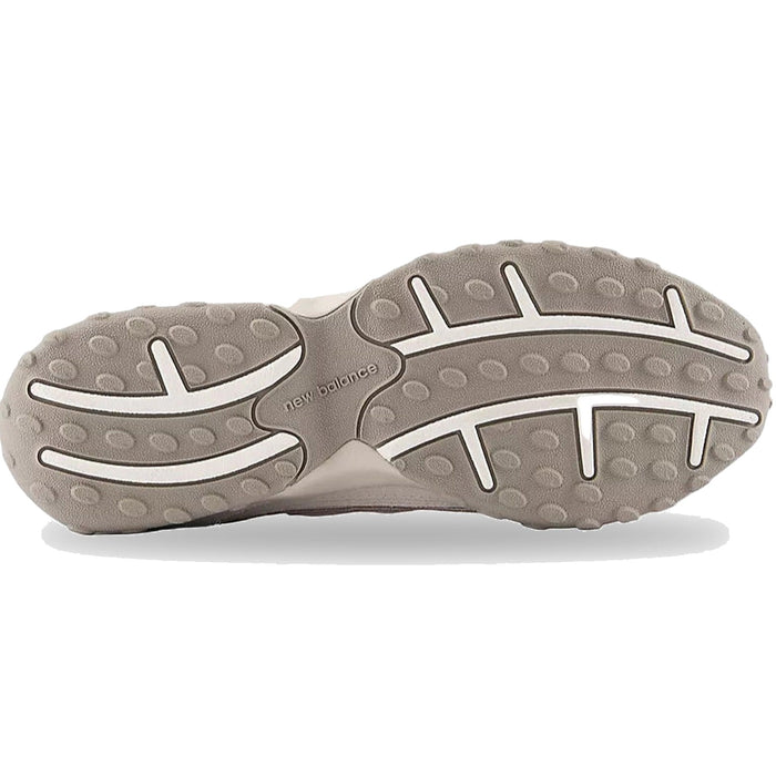 Close-up of a gray shoe sole with New Balance branding on a white background
