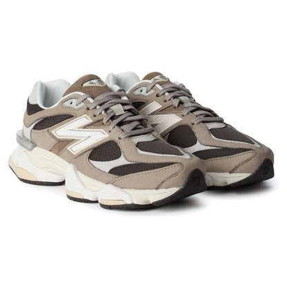 Pair of brown and white sneakers on a white background