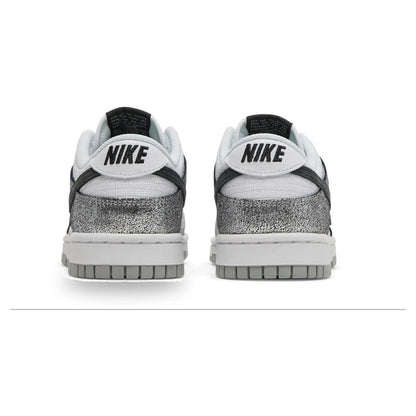 Pair of Nike sneakers with a white sole on a white background
