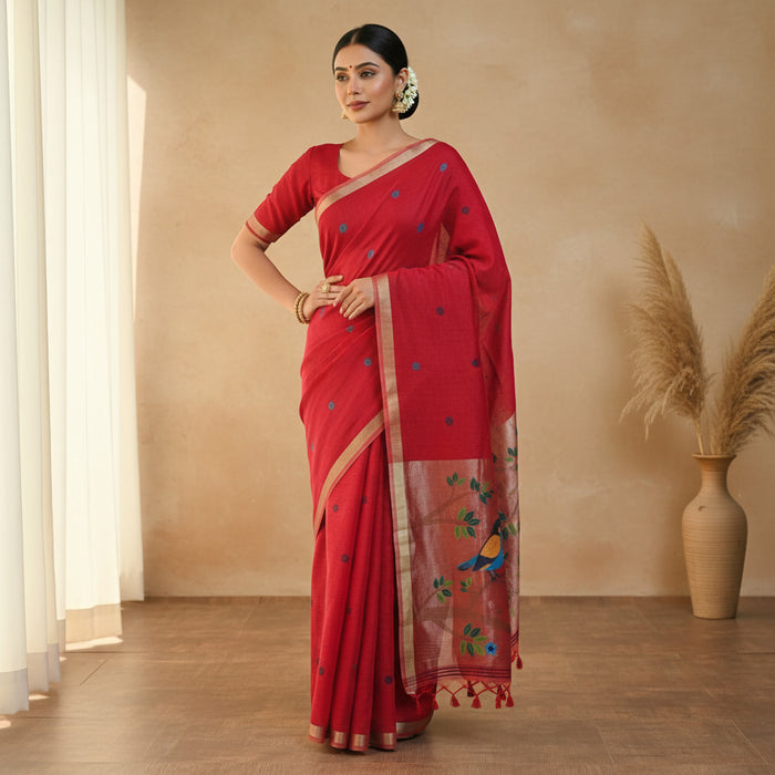 Red saree with bird and floral patterns on a white background