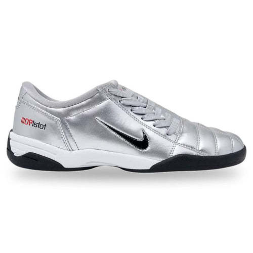 Silver sports shoe with black sole on a white background